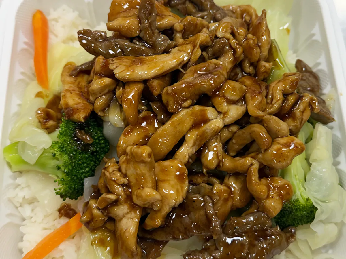 Teriyaki chicken and beef with broccoli served over white rice